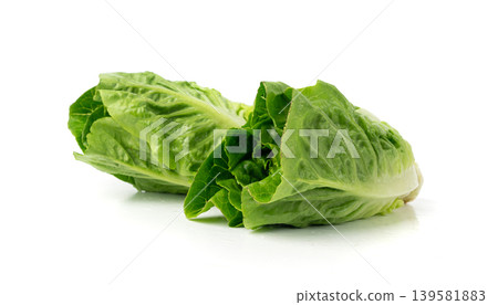 Two romaine lettuce salad isolated. Cos green leaves, fresh romain salat head, raw cabbage Two romaine lettuce salad isolated. Cos green leaves, fresh romain salat head, raw cabbage 139581883