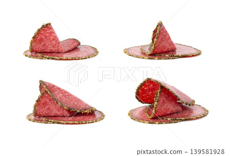 Pepper salami cuts isolated, thin sausage slices. Sliced dry chorizo, sausages round pieces Pepper salami cuts isolated, thin sausage slices. Sliced dry chorizo, sausages round pieces 139581928