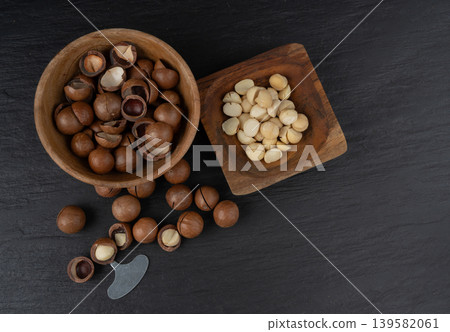 Macadamia nuts. Natural raw peeled macadamia seeds and shells Macadamia nuts. Natural raw peeled macadamia seeds and shells 139582061
