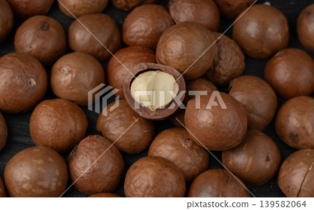 Macadamia nuts pattern. Natural raw peeled macadamia seeds and shells 139582064