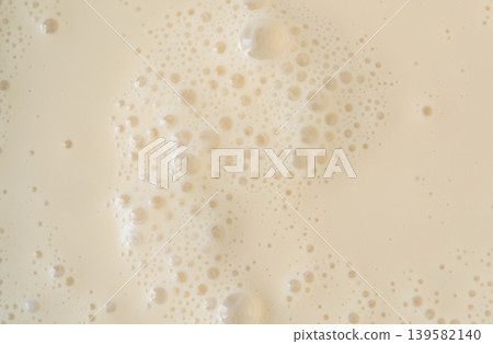 Coffee milkshake texture closeup Coffee milkshake texture closeup 139582140