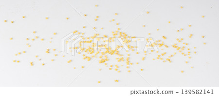 Raw millet grains pile isolated. Little yellow cereal, natural foxtail small seeds Raw millet grains pile isolated. Little yellow cereal, natural foxtail small seeds 139582141