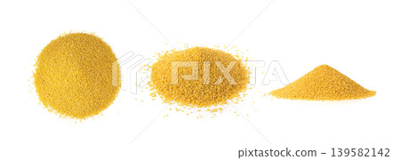 Raw millet grains pile isolated. Little yellow cereal, natural foxtail small seeds Raw millet grains pile isolated. Little yellow cereal, natural foxtail small seeds 139582142