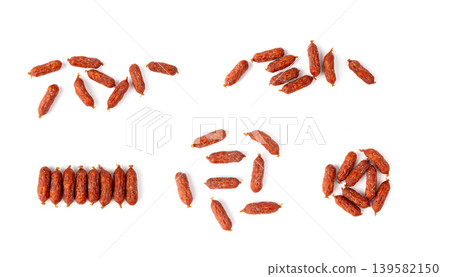 Mini Sausages Isolated, Dry Smoked Salami Sticks Mini Sausages Isolated, Dry Smoked Salami Sticks 139582150