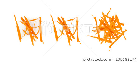 Thin carrot strips isolated. Carrot slices for vegetable salad Thin carrot strips isolated. Carrot slices for vegetable salad 139582174