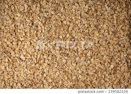 Oat flakes textured pattern, rolled oatmeal macro background 139582226