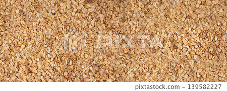 Oat flakes textured pattern, rolled oatmeal macro background 139582227