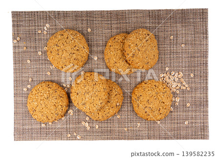 Whole and broken oatmeal cookies, cereal biscuits, fitness bakery Whole and broken oatmeal cookies, cereal biscuits, fitness bakery 139582235