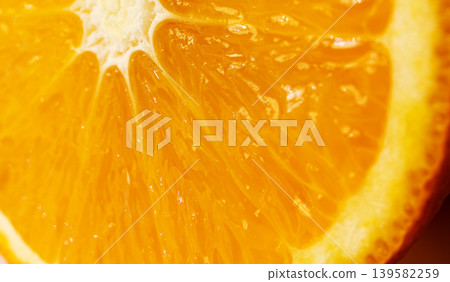 Orange fruit slice macro textured background Orange fruit slice macro textured background 139582259