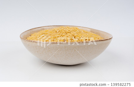 Raw orzo pasta, risoni or kritharaki pile 139582275