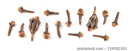 Clove spice isolated. Macro dry carnation spicy buds, natural Indian clove condiment Clove spice isolated. Macro dry carnation spicy buds, natural Indian clove condiment 139582301