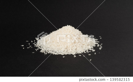 Grated coconut powder. Dry coco flakes pile, shredded desiccated coconut, tropical fruit chips Grated coconut powder. Dry coco flakes pile, shredded desiccated coconut, tropical fruit chips 139582315