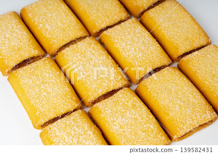 Fig roll bar, square sugar cookies with fruit filling isolated 139582431