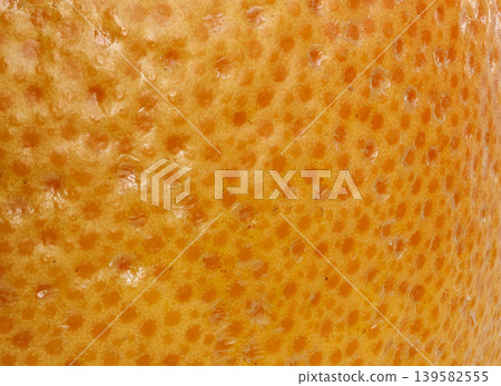 Grapefruit skin macro texture, orange citrus fruit peel detailed pattern 139582555