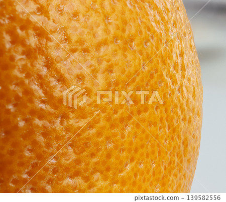 Grapefruit skin macro texture, orange citrus fruit peel detailed pattern Grapefruit skin macro texture, orange citrus fruit peel detailed pattern 139582556