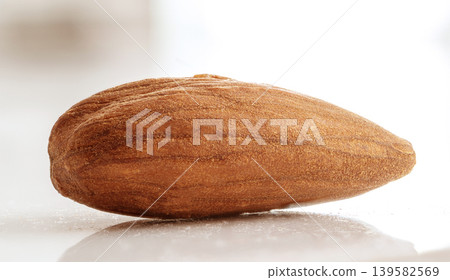 Almonds closeup isolated, nut group Almonds closeup isolated, nut group 139582569