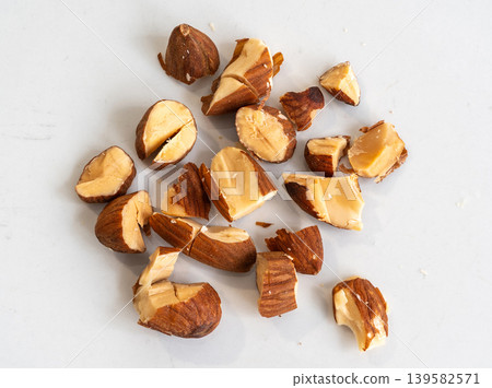 Crushed almonds macro texture on white Crushed almonds macro texture on white 139582571