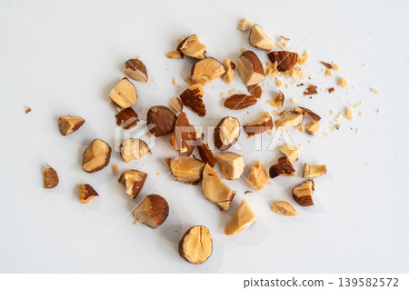 Crushed almonds macro texture on white Crushed almonds macro texture on white 139582572
