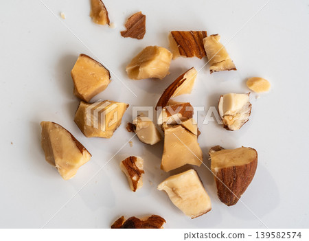 Crushed almonds macro texture on white Crushed almonds macro texture on white 139582574