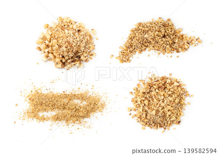 Grated wallnut , broken roasted walnuts, heap of nuts crumbs, whole kernel pieces, fractions Grated wallnut , broken roasted walnuts, heap of nuts crumbs, whole kernel pieces, fractions 139582594