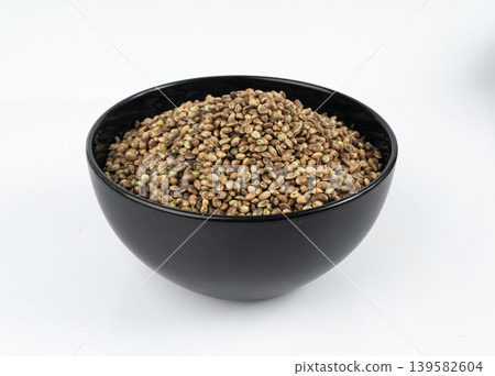 Hemp seeds, cannabis grains, marijuana kernels, oil hempseeds pile Hemp seeds, cannabis grains, marijuana kernels, oil hempseeds pile 139582604