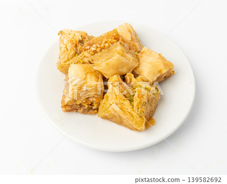 Baklava Isolated, Small Ramadan Dessert, Eastern Sweet Filo Pastries, Turkish Honey Baklawa, Oriental Desert Baklava Isolated, Small Ramadan Dessert, Eastern Sweet Filo Pastries, Turkish Honey Baklawa, Oriental Desert 139582692