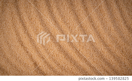 Brown cane sugar pile textured background top view 139582825