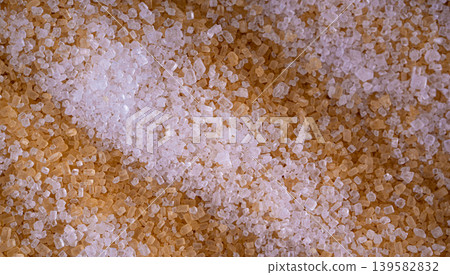 Brown cane sugar pile textured background top view Brown cane sugar pile textured background top view 139582832