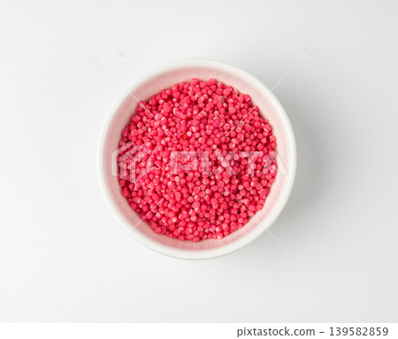 Candy sprinkle pile, round sugar sprinkles, small sweet color confectionery decoration balls Candy sprinkle pile, round sugar sprinkles, small sweet color confectionery decoration balls 139582859