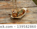 Takoyaki - traditional Japanese street food, outdoor snack with octopus Takoyaki fried balls Takoyaki - traditional Japanese street food, outdoor snack with octopus Takoyaki fried balls 139582860