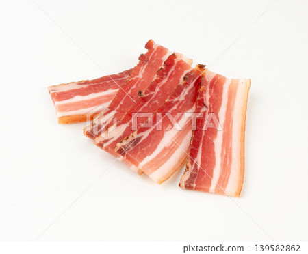 Cured carbonara pork isolated, raw smoked bacon, streaky brisket on white background Cured carbonara pork isolated, raw smoked bacon, streaky brisket on white background 139582862