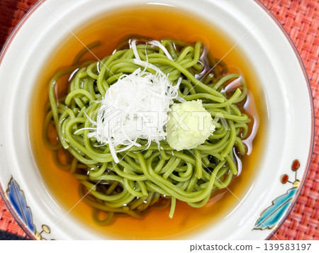 A refreshing Japanese dish featuring green tea soba noodles. A refreshing Japanese dish featuring green tea soba noodles. 139583197