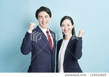 Male and female business people doing guts pose Male and female business people doing guts pose 139583605
