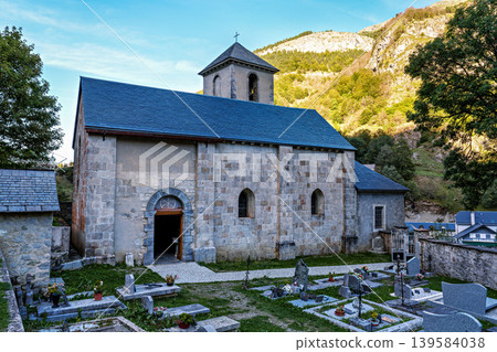 The church Notre Dame du Bon Port with cemetery in the mountain village Gavarnie-Gedre in Hautes-Pyrenees, France. The church Notre Dame du Bon Port with cemetery in the mountain village Gavarnie-Gedre in Hautes-Pyrenees, France. 139584038