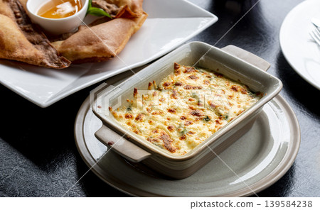 Delicious Baked Spinach with Cheese and Crispy Golden Appetizers Delicious Baked Spinach with Cheese and Crispy Golden Appetizers 139584238