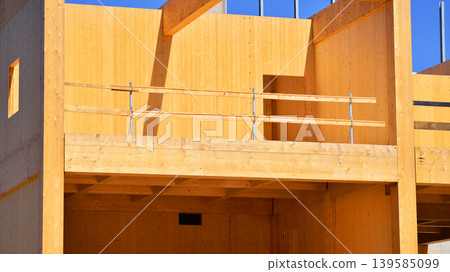 Laminate wood floors and supports of a mass timber multi story green, sustainable office building construction project Laminate wood floors and supports of a mass timber multi story green, sustainable office building construction project 139585099