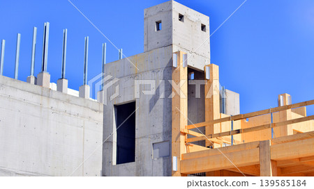 Laminate wood floors and supports of a mass timber multi story green, sustainable office building construction project. The building structure also has concrete walls. 139585184