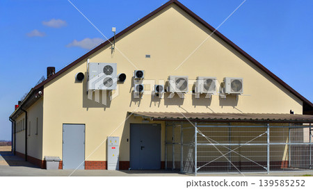 Air conditioners on the wall of a commercial building. Air conditioners on the wall of a commercial building. 139585252