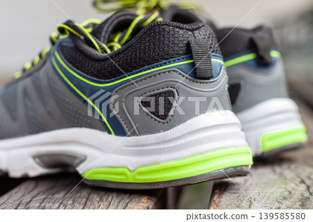 Close-Up of Sport Shoe Heel with Neon Green Cushioning Detail Close-Up of Sport Shoe Heel with Neon Green Cushioning Detail 139585580