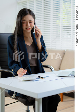 women talk mobile phones appointment reminders in calendar on interface. working on laptop computers, online business. women talk mobile phones appointment reminders in calendar on interface. working on laptop computers, online business. 139585619