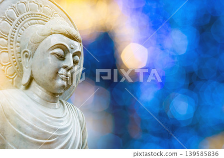 Serene White Marble Buddha Face on Background Serene White Marble Buddha Face on Background 139585836