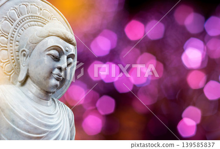 Serene White Marble Buddha Face on Purple Bokeh Background Serene White Marble Buddha Face on Purple Bokeh Background 139585837