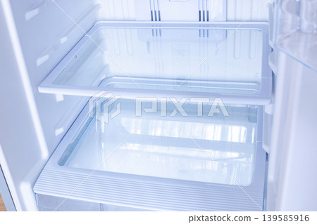 new modern refrigerator opens to reveal the inside, empty refrigerator new modern refrigerator opens to reveal the inside, empty refrigerator 139585916