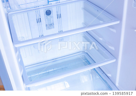 new modern refrigerator opens to reveal the inside, empty refrigerator new modern refrigerator opens to reveal the inside, empty refrigerator 139585917