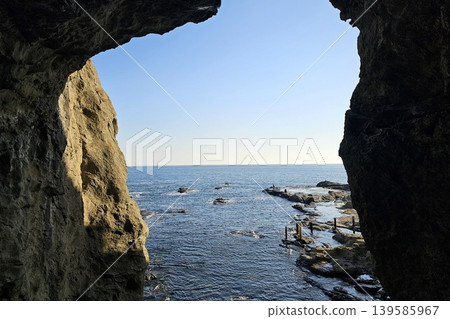 Enoshima Iwaya Caves on the southern coast of Enoshima Island in Japan. Enoshima Iwaya Caves on the southern coast of Enoshima Island in Japan. 139585967