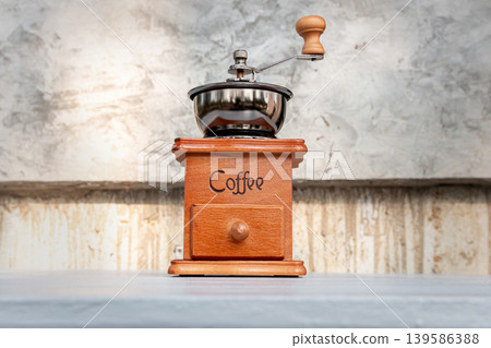 Vintage Coffee Grinder on Wood Log at Camping Site Vintage Coffee Grinder on Wood Log at Camping Site 139586388