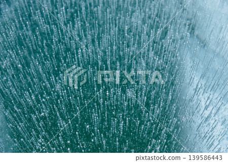 Frozen methane bubbles trapped in Lake Baikal ice, winter natural texture background Frozen methane bubbles trapped in Lake Baikal ice, winter natural texture background 139586443