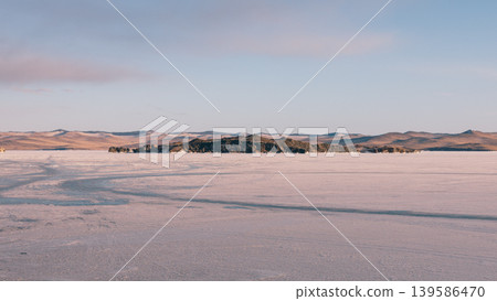 Frozen Lake Baikal landscape with island and pastel winter sky, Maloye More Frozen Lake Baikal landscape with island and pastel winter sky, Maloye More 139586470