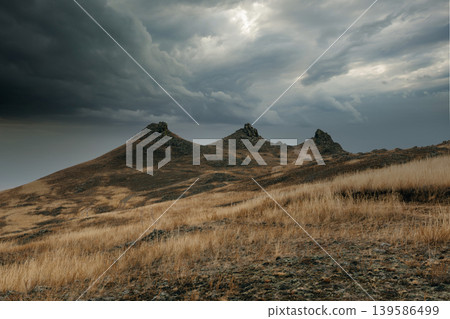 Storm clouds over Khorgoy Cape steppe hills on Lake Baikal, Russia landscape Storm clouds over Khorgoy Cape steppe hills on Lake Baikal, Russia landscape 139586499