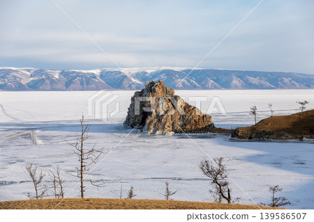 Shamanka Rock on frozen Lake Baikal near Khuzhir village, Olkhon Island, Russia Shamanka Rock on frozen Lake Baikal near Khuzhir village, Olkhon Island, Russia 139586507